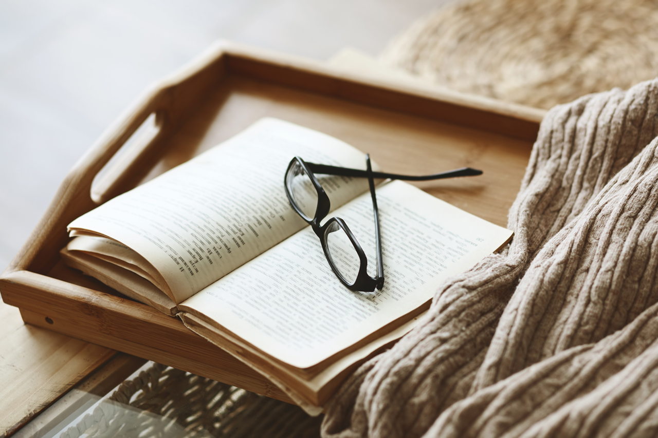 eye glasses on tray in bed